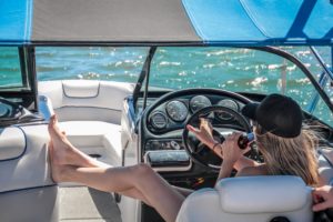 Woman Drinking While Driving Speedboat