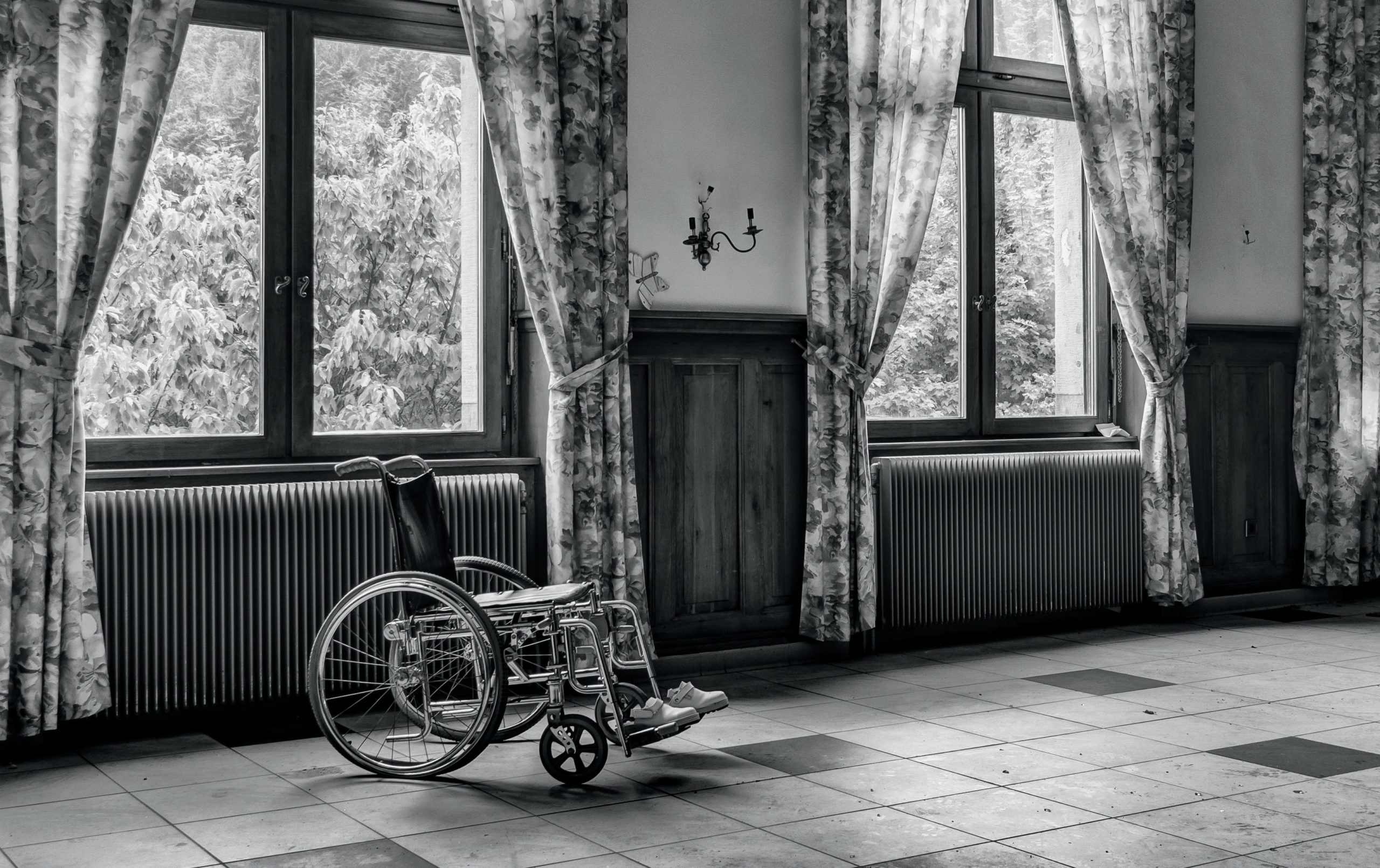 empty wheelchair in black and white room