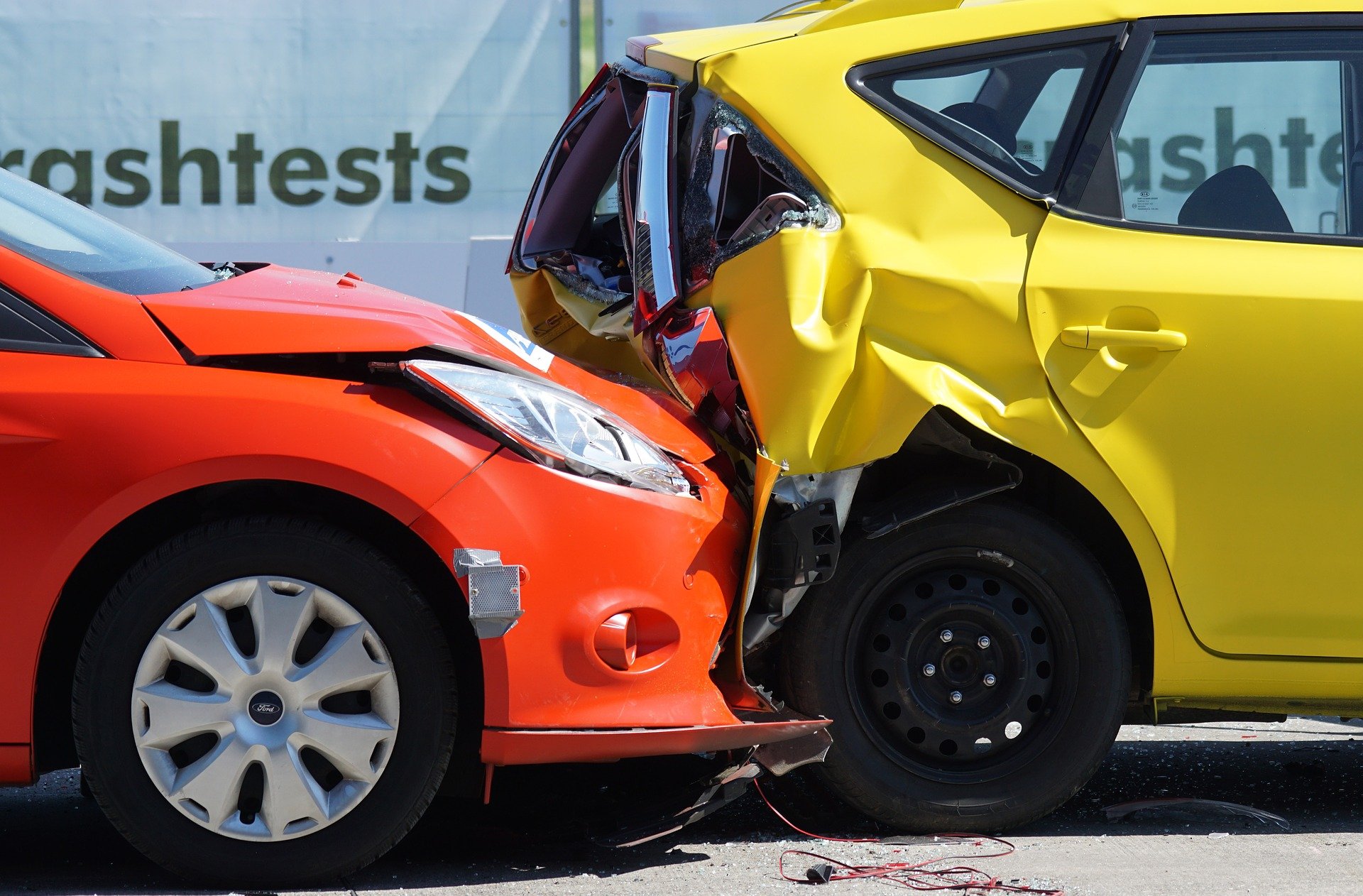 orange car hitting yellow car