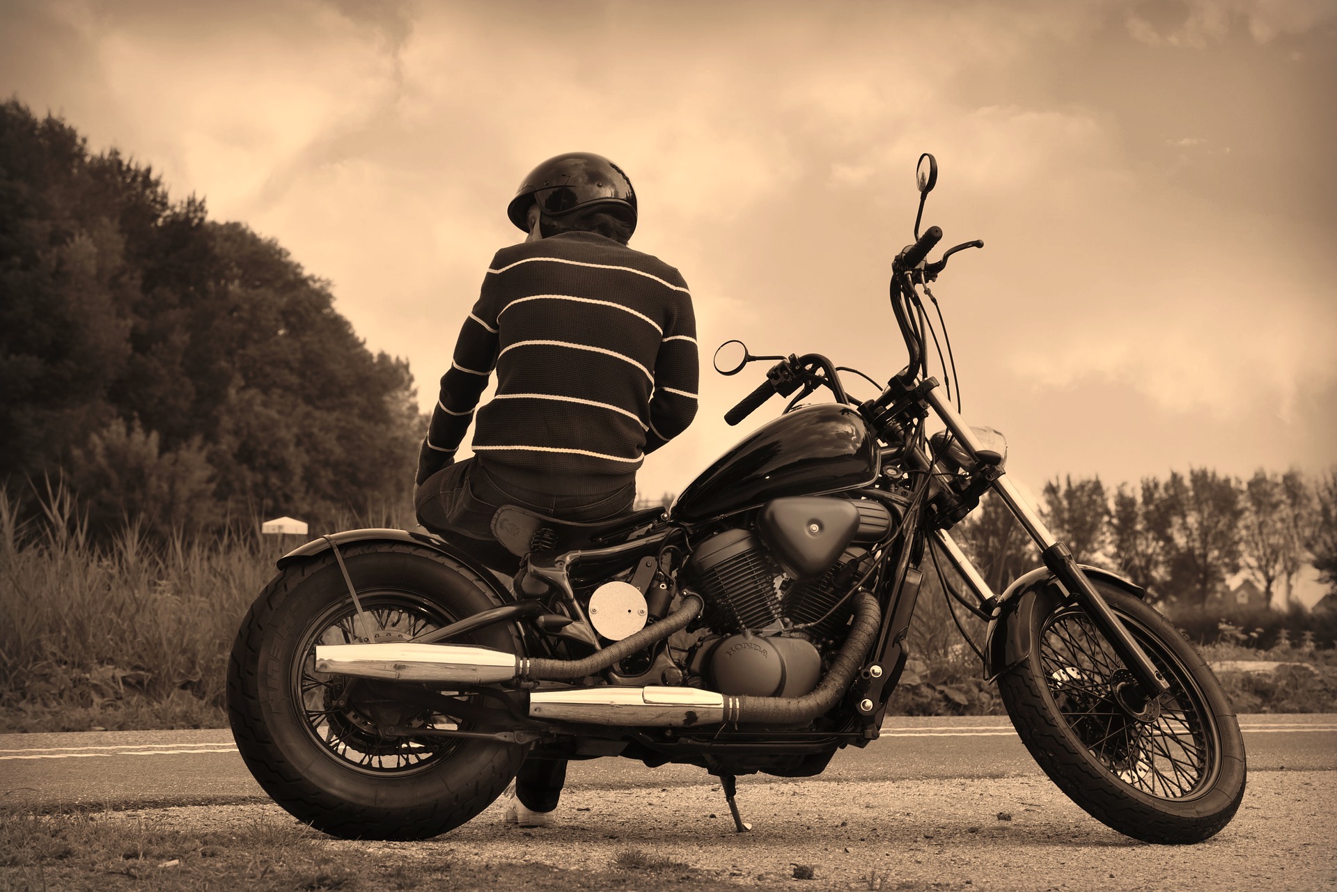 person sitting on motorcycle