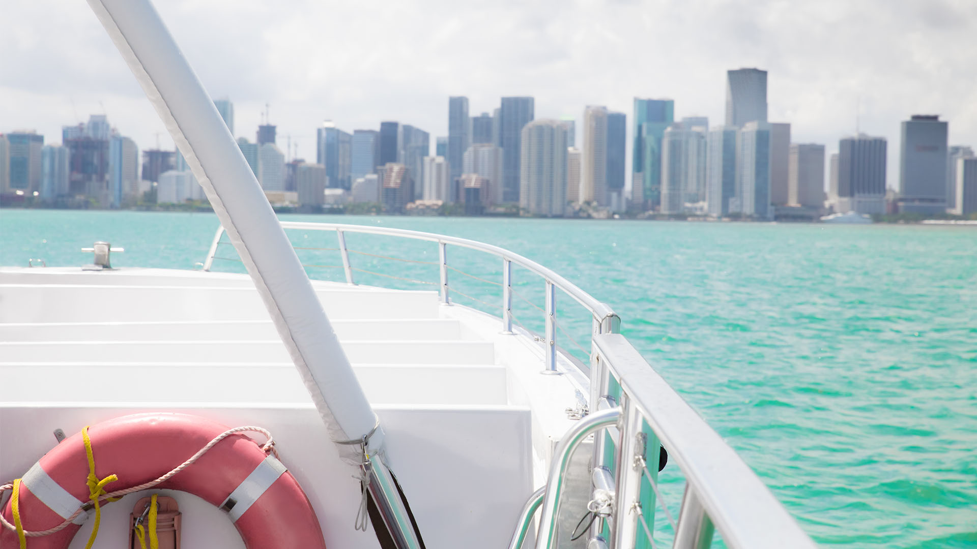 view of cityscape from small boat with life preserver