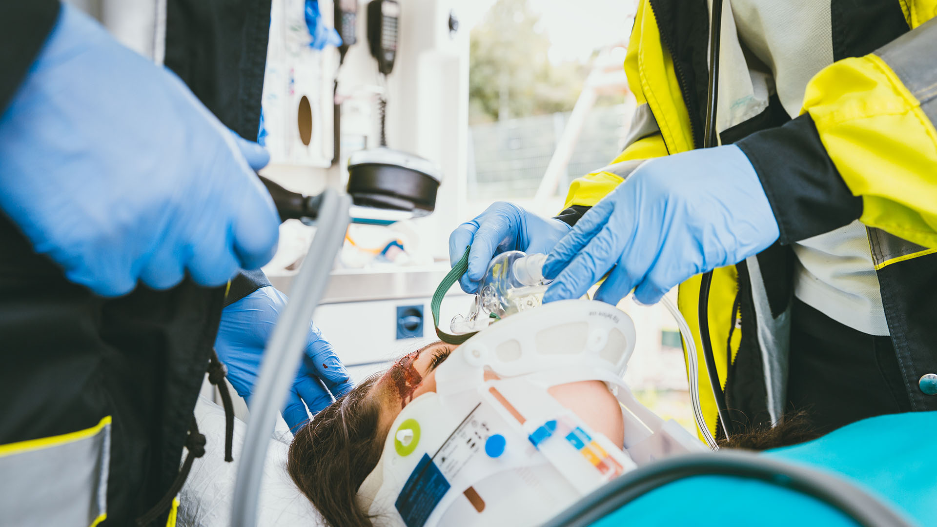 paramedics care for patient on stretcher